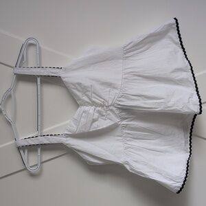 White Sleeveless Top with Black Trim (Fits Like A Small Or medium)